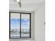 Bright bedroom with floor-to-ceiling sliding glass doors that lead to a balcony with beautiful water views at 100 1St N Ave # 2304, St Petersburg, FL 33701