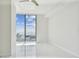 Bedroom with tile floors, a ceiling fan, and floor to ceiling glass windows that allow lots of natural light at 100 1St N Ave # 2304, St Petersburg, FL 33701