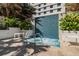Tranquil spa area featuring a hot tub with a mosaic tile accent wall and lush landscaping at 100 1St N Ave # 2304, St Petersburg, FL 33701