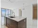 Kitchen island with a stainless steel sink and modern fixtures providing style and functionality at 100 1St N Ave # 2304, St Petersburg, FL 33701