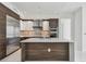 Well-equipped kitchen with stainless steel appliances, a large island, and sleek, two-tone cabinetry at 100 1St N Ave # 2304, St Petersburg, FL 33701