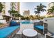 Stunning pool area surrounded by palm trees and lounge seating, offering a resort-style experience at 100 1St N Ave # 2304, St Petersburg, FL 33701