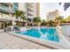 Beautiful pool area featuring lounge chairs, tropical landscaping and modern building architecture at 100 1St N Ave # 2304, St Petersburg, FL 33701