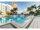 Resort-style pool area with palm trees, contemporary seating, and modern building architecture at 100 1St N Ave # 2304, St Petersburg, FL 33701