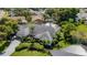 Aerial view of the home showcasing its well-maintained landscaping, exterior architecture, and peaceful neighborhood setting at 1000 Chatham Ct, Safety Harbor, FL 34695