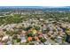 A neighborhood aerial showing mature trees, ponds, and well-maintained homes at 1000 Chatham Ct, Safety Harbor, FL 34695