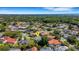 Residential aerial showcasing a neighborhood with lush greenery, manicured lawns, and beautiful homes at 1000 Chatham Ct, Safety Harbor, FL 34695