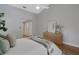 Cozy bedroom with wood floors, a vaulted ceiling, and modern decor at 1000 Chatham Ct, Safety Harbor, FL 34695