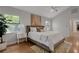 Relaxing bedroom with hardwood floors, an accent rug and bright windows at 1000 Chatham Ct, Safety Harbor, FL 34695