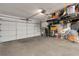Spacious two car garage providing ample parking and storage with overhead storage racks at 1000 Chatham Ct, Safety Harbor, FL 34695