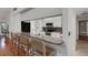 Kitchen bar with seating area overlooking the updated kitchen at 1000 Chatham Ct, Safety Harbor, FL 34695