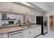 Open-concept kitchen with stainless steel appliances, and granite countertops at 1000 Chatham Ct, Safety Harbor, FL 34695