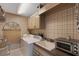 Functional laundry room featuring a washing machine, sink, and cabinets for efficient home management at 1000 Chatham Ct, Safety Harbor, FL 34695