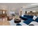 Open concept living space featuring hardwood floors and a stylish dining area and open kitchen in background at 1000 Chatham Ct, Safety Harbor, FL 34695