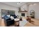 Bright living room featuring hardwood floors, vaulted ceilings, fireplace, and modern decor at 1000 Chatham Ct, Safety Harbor, FL 34695