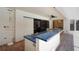 Outdoor kitchen area featuring a blue-tiled countertop and a cooktop, ideal for outdoor gatherings at 1000 Chatham Ct, Safety Harbor, FL 34695