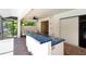 Outdoor kitchen with cooktop and sink, next to an enclosed patio, ideal for entertaining guests at 1000 Chatham Ct, Safety Harbor, FL 34695