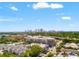 An aerial view of a modern apartment complex with a cityscape in the distance at 1011 S Moody Ave # 11, Tampa, FL 33629