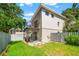 Exterior view of the building featuring a balcony, backyard and green grass at 1011 S Moody Ave # 11, Tampa, FL 33629