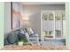 View of the cozy living room showcasing natural light and comfortable seating at 1011 S Moody Ave # 11, Tampa, FL 33629