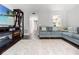 Spacious living room featuring stylish furniture and a view into the kitchen at 1011 S Moody Ave # 11, Tampa, FL 33629