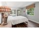 Cozy bedroom with a large window and mirrored closet doors at 1011 S Moody Ave # 11, Tampa, FL 33629