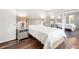 A comfortable bedroom featuring hardwood floors and mirrored closet doors at 1011 S Moody Ave # 11, Tampa, FL 33629