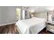 A sunlit bedroom with hardwood floors and an adjacent bathroom at 1011 S Moody Ave # 11, Tampa, FL 33629