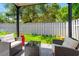 Relaxing patio area with outdoor seating and a view of the green lawn at 1011 S Moody Ave # 11, Tampa, FL 33629