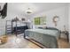 Bedroom with bunk beds, a full-size bed, and a mounted TV at 10730 52Nd N Ave, St Petersburg, FL 33708