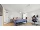 Bedroom featuring tile floors, fan, and a makeup vanity with mirror at 10730 52Nd N Ave, St Petersburg, FL 33708