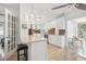 Bright kitchen features white cabinets, granite countertops, mosaic backsplash, and stainless steel appliances at 10730 52Nd N Ave, St Petersburg, FL 33708