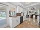 Bright kitchen with quartz countertops, modern appliances, and tile flooring at 10730 52Nd N Ave, St Petersburg, FL 33708