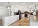 Modern kitchen with white cabinets, granite countertops, stainless steel appliances, and decorative backsplash at 10730 52Nd N Ave, St Petersburg, FL 33708