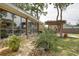 Charming patio with comfortable seating and pergola creating a serene outdoor living area at 10730 52Nd N Ave, St Petersburg, FL 33708