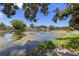 Picturesque water view with lush landscaping and serene waterfront ambiance at 10730 52Nd N Ave, St Petersburg, FL 33708