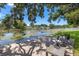 Waterfront deck with tranquil views and outdoor seating, perfect for enjoying the scenery at 10730 52Nd N Ave, St Petersburg, FL 33708