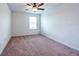 Cozy bedroom boasts natural light, neutral paint, and a ceiling fan at 11035 Sage Canyon Dr, Riverview, FL 33578
