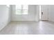 Bright living room with modern tile flooring and a large window allowing natural light to flood the space at 11035 Sage Canyon Dr, Riverview, FL 33578