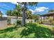 This backyard offers a beautiful lawn, white fence, and foliage at 11301 80Th Ave, Seminole, FL 33772