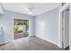Light-filled bedroom with sliding glass doors that provide access to the outdoor patio area at 11301 80Th Ave, Seminole, FL 33772