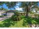 Charming single-story home with a well-manicured lawn and mature trees providing ample shade at 11301 80Th Ave, Seminole, FL 33772