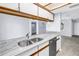 Bright kitchen features modern appliances, white marble countertops, and an open floor plan at 11301 80Th Ave, Seminole, FL 33772