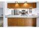 Modern kitchen featuring a breakfast bar with a granite countertop and stainless steel appliances at 11301 80Th Ave, Seminole, FL 33772