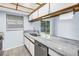 Bright kitchen featuring granite countertops, stainless steel appliances, and plenty of natural light at 11301 80Th Ave, Seminole, FL 33772