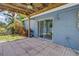 Open patio with sliding glass door and wooden ceiling with fan at 11301 80Th Ave, Seminole, FL 33772
