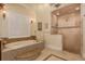 The bathroom features a soaking tub with mosaic tile surround and a separate walk-in shower at 11430 Trotting Down Dr, Odessa, FL 33556