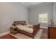 Cozy bedroom with wood floors features soft natural light and neutral colors create relaxing retreat at 11430 Trotting Down Dr, Odessa, FL 33556