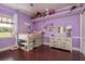 Fun bedroom featuring a unique bunk bed design, hardwood floors, and ample natural light at 11430 Trotting Down Dr, Odessa, FL 33556