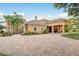 Spacious home exterior featuring a circular driveway, and portico entry area offering ample parking at 11430 Trotting Down Dr, Odessa, FL 33556
